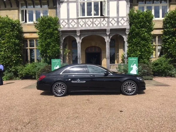 Mercedes S Class outside a Tudor style house at Cowdray