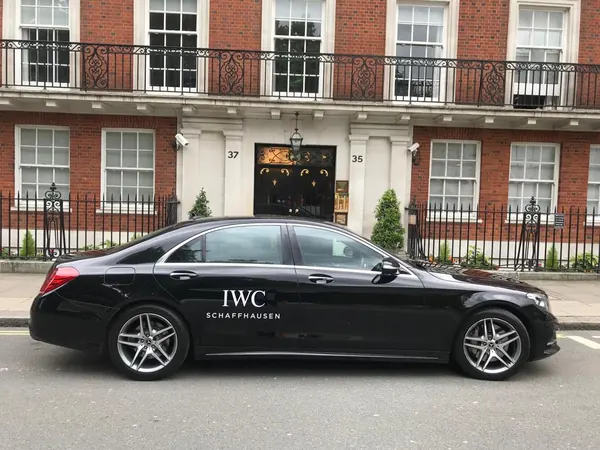 IWC branded Mercedes S Class outside a London townhouse
