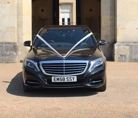 Mercedes S Class with white wedding ribbons