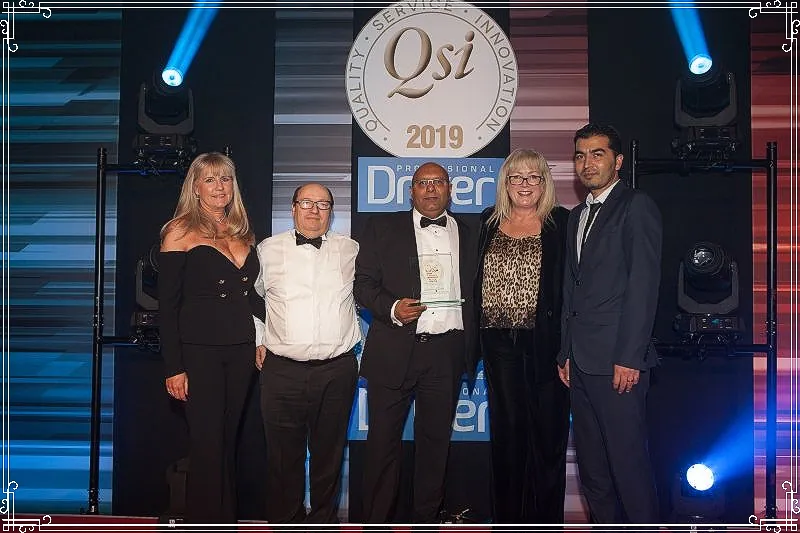 The Embassy Cars team collecting their award at the QSI Awards 2019